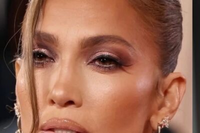 Jennifer Lopez did not have her strongest moment on the Golden Globes red carpet this year—and yes, I said it. In a sea of drama, sparkle, and high-risk fashion, J.Lo’s look somehow managed to feel… heavy. Not emotionally heavy—stylistically heavy. The dress was structured to the point of severity, the fabric weighed down her movement, and the makeup leaned more “bronze armor” than glowing goddess. For someone who has built an entire beauty empire on radiance and warmth, this felt oddly harsh.