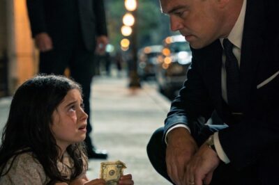 As the mafia boss exited his car, a small trembling hand brushed his—no weapon, no danger—just a crumpled five-dollar bill. A frightened little girl stared up at him like he was her last hope, turning a routine moment into something unforgettable.