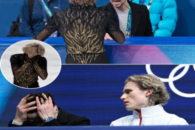 Under the blinding Olympic lights, the cameras caught it: the clenched jaw, the faraway stare, the pause that lasted just two seconds but felt endless. When Ilia Malinin stepped off the ice with a historic silver medal, the narrative seemed obvious — the “Quad God” had fallen short of gold.